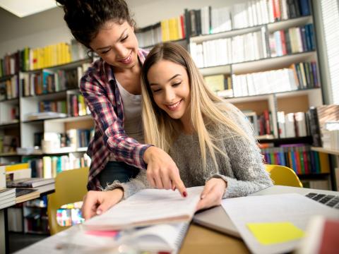 Teacher helping student