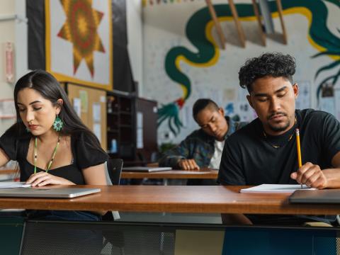 Indigenous students studying in class.