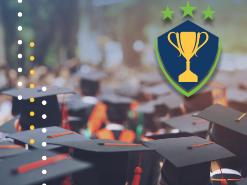 Graduates stand in a group. The photo is taken from behind to only show their graduation caps. A trophy icon is placed in the upper right corner.